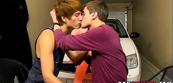  Two naughty twinks having fun in garage with a blow-up doll
